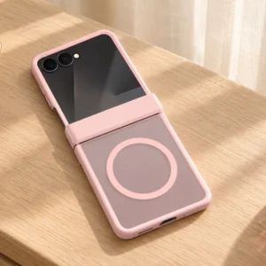 DUXDUCIS Phone Case for Samsung Z-Flip8 - Pink Samsung Z Flip8 case fully unfolded on a pale oak dressing table beside a cream jewelry dish and plum glass perfume bottle