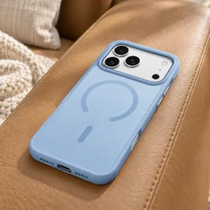 DUXDUCIS Phone Case for iPhone 18 &17 Pro - Light Blue case resting on a tan leather sofa armrest in a sunlit living room