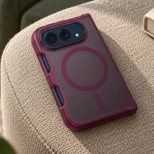 DUXDUCIS iPhone Case for iPhone Duo - Dark Cherry standard case on a woven ottoman in a softly lit reading room