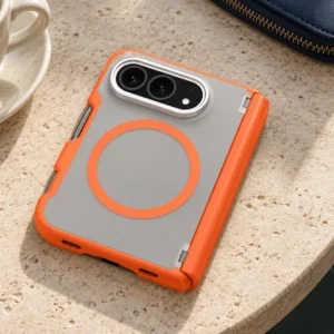 DUXDUCIS Phone Case for iPhone Duo V2 - Orange EXPN Series iPhone Duo case on a pale travertine cafe table beside a cream espresso cup and navy canvas pouch